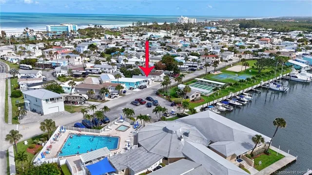 an aerial view of a houses with outdoor space