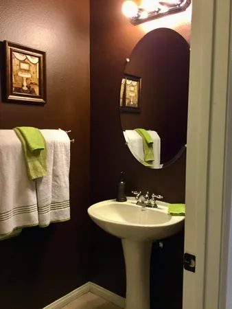 a bathroom with a sink and mirror