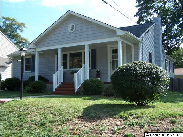 1302 Squirrel Road Wall, NJ 07719 - Photo 1 of 3 a view of a house with a yard and plants