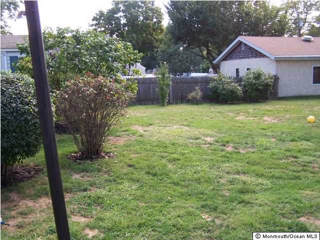 1302 Squirrel Road Wall, NJ 07719 - Photo 2 of 3 a view of a house with a yard