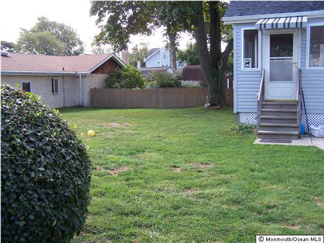 1302 Squirrel Road Wall, NJ 07719 - Photo 3 of 3 a front view of a house with garden