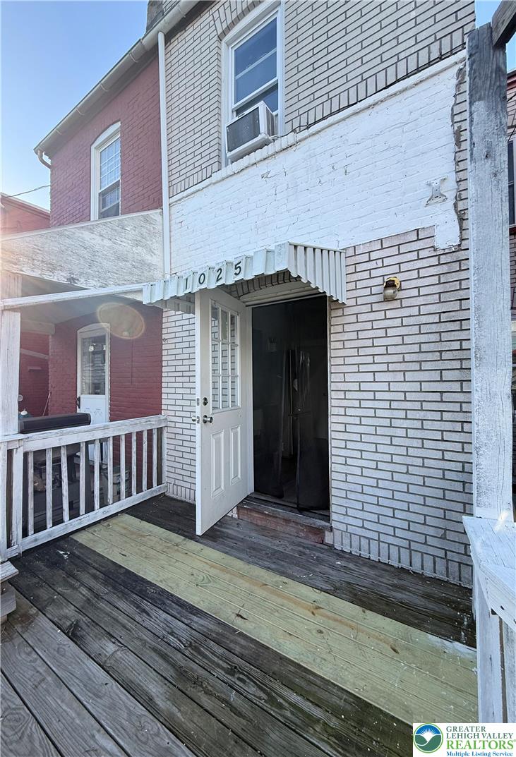 1025 Spring Street Bethlehem, PA 18018 - Photo 20 of 20 A classic brick facade with an inviting front porch and a distinctive awning.