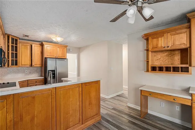 a kitchen with stainless steel appliances granite countertop a sink and a microwave