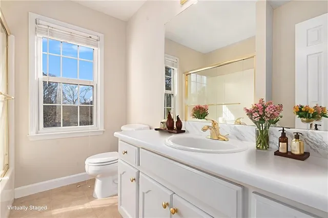 a bathroom with a sink a vanity and a mirror