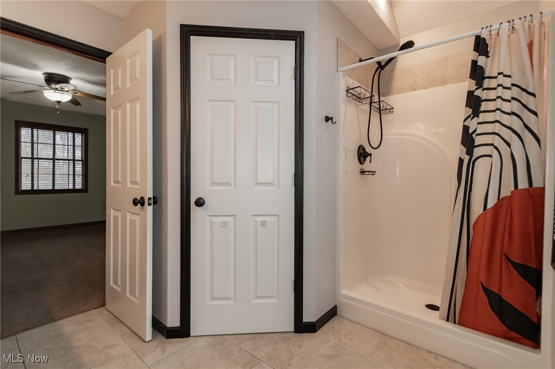 4815 South Ridge Road Perry, OH 44081 - Photo 19 of 48 Bathroom featuring a shower stall and a ceiling fan