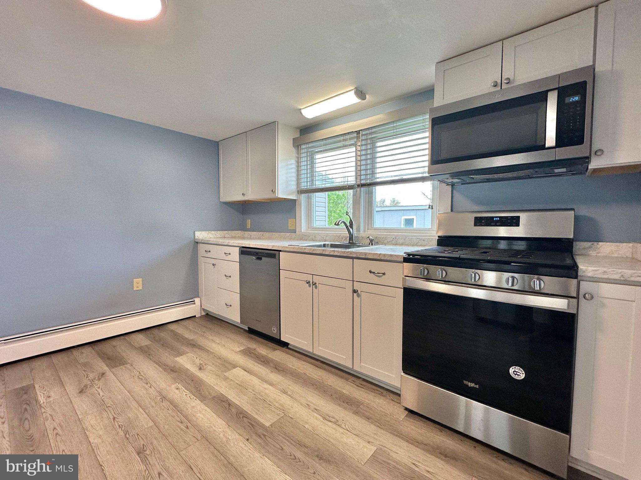 21530 Coopertown Road Tilghman, MD 21671 - Photo 6 of 17 Modern kitchen with sleek finishes.