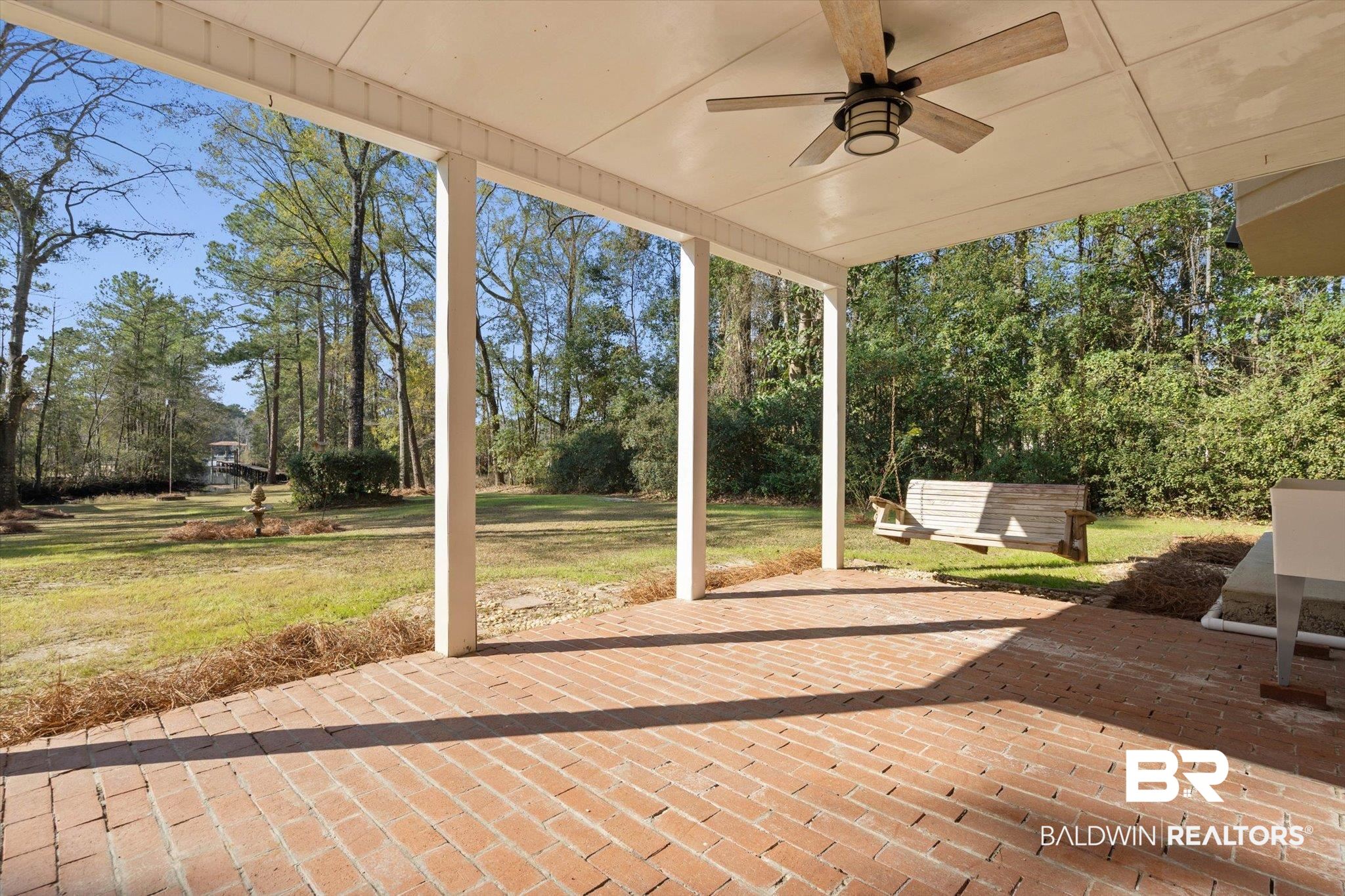 3847 Riviere Du Chien Road Mobile, AL 36693 - Photo 25 of 51 View of patio / terrace with ceiling fan and view of scattered trees