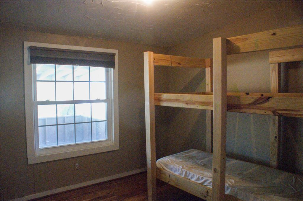 7424 North Locust Street Denton, TX 76207 - Photo 5 of 9 a bathroom with a sink and a mirror
