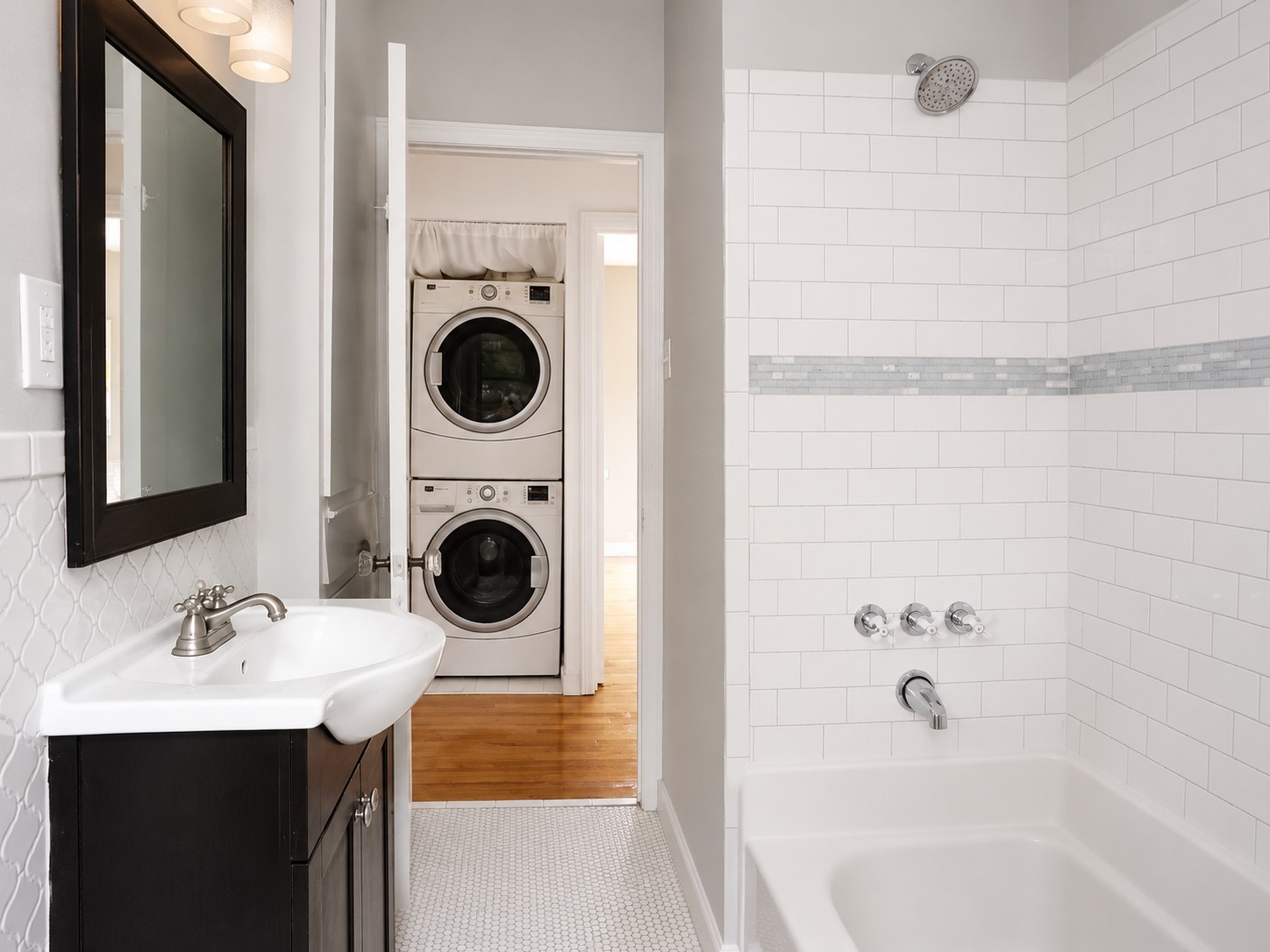 907 East 56th Street Austin, TX 78751 - Photo 13 of 13 a bathroom with a sink a mirror and bathtub