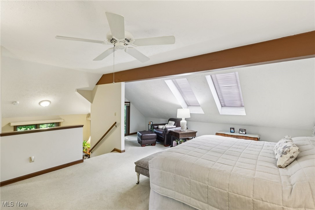235 Solon Road, Unit D Chagrin Falls, OH 44022 - Photo 20 of 37 Second floor primary bedroom with beamed ceriling