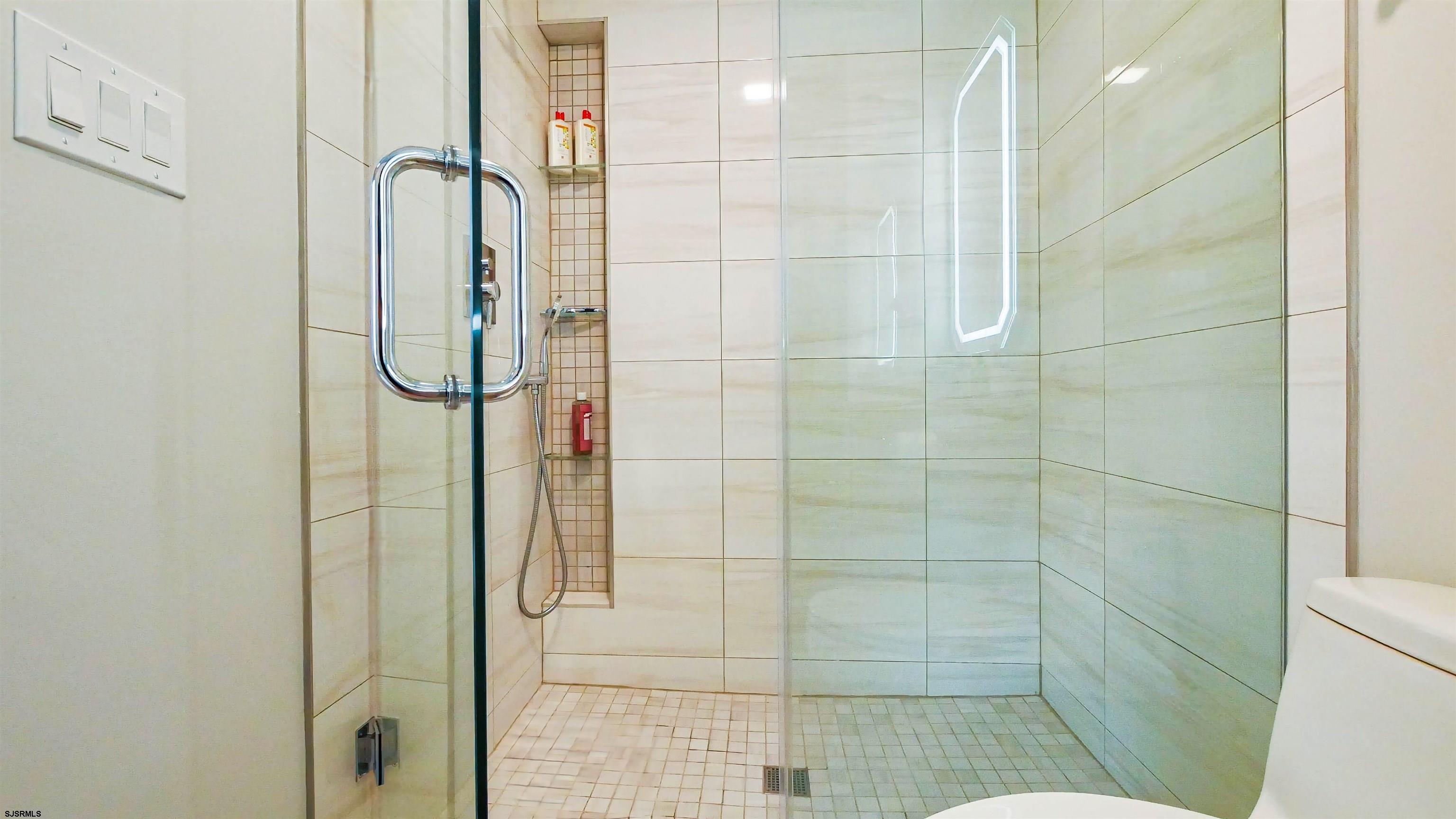 15 North Jefferson Avenue, Unit B Margate City, NJ 08402 - Photo 12 of 13 a bathroom with a shower