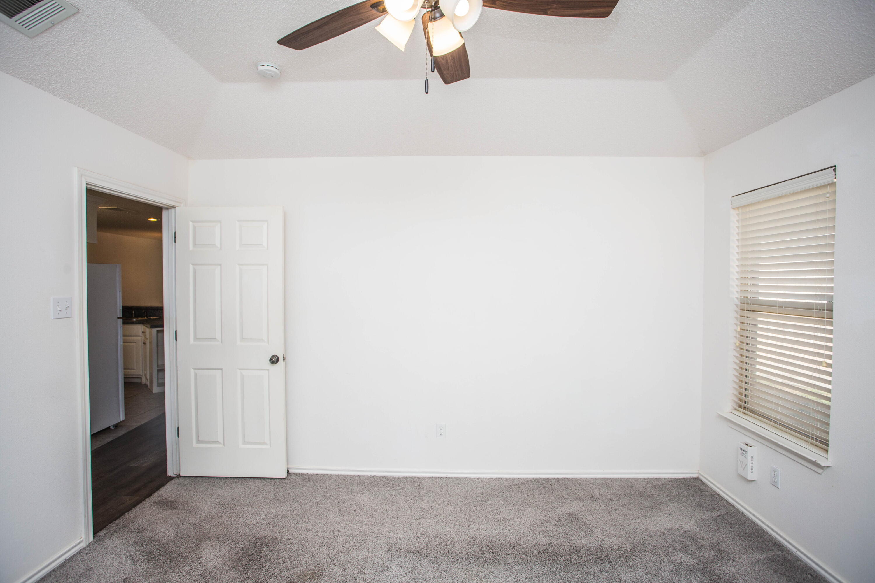 3114 111th Street Lubbock, TX 79423 - Photo 15 of 26 an empty room with windows