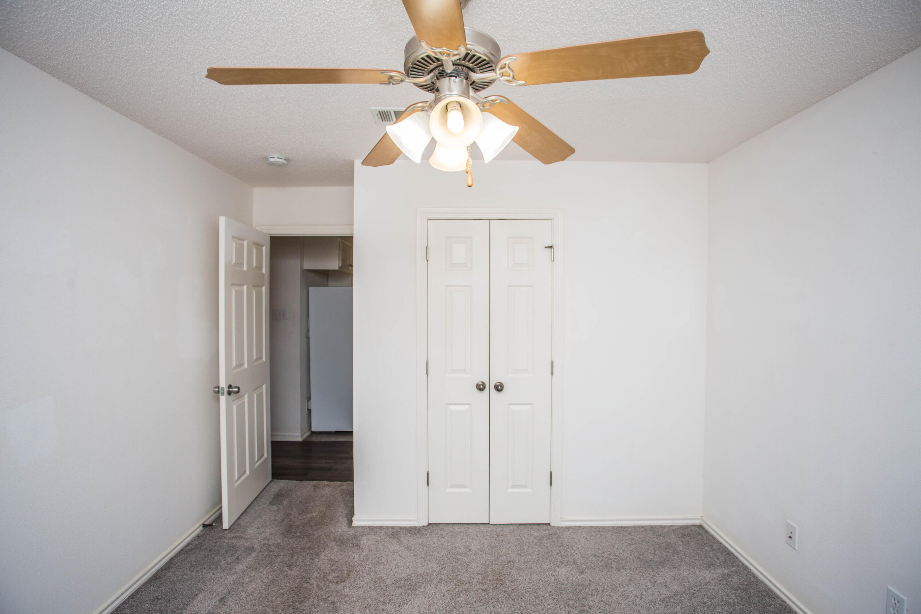 3114 111th Street Lubbock, TX 79423 - Photo 20 of 26 an empty room with windows and fan