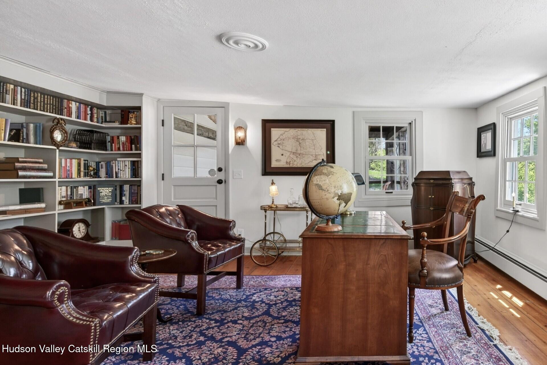 1429 Jackson Corners Road Red Hook, NY 12571 - Photo 17 of 59 a view of a livingroom with workspace and a window