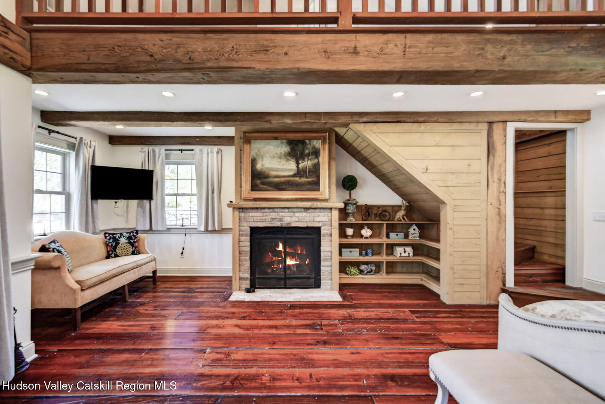 1429 Jackson Corners Road Red Hook, NY 12571 - Photo 21 of 59 a living room with furniture and a fireplace