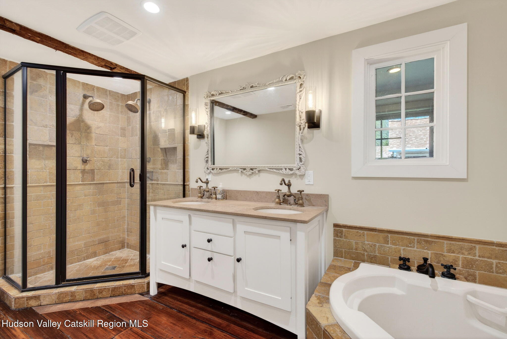 1429 Jackson Corners Road Red Hook, NY 12571 - Photo 22 of 59 a bathroom with a tub sink and mirror