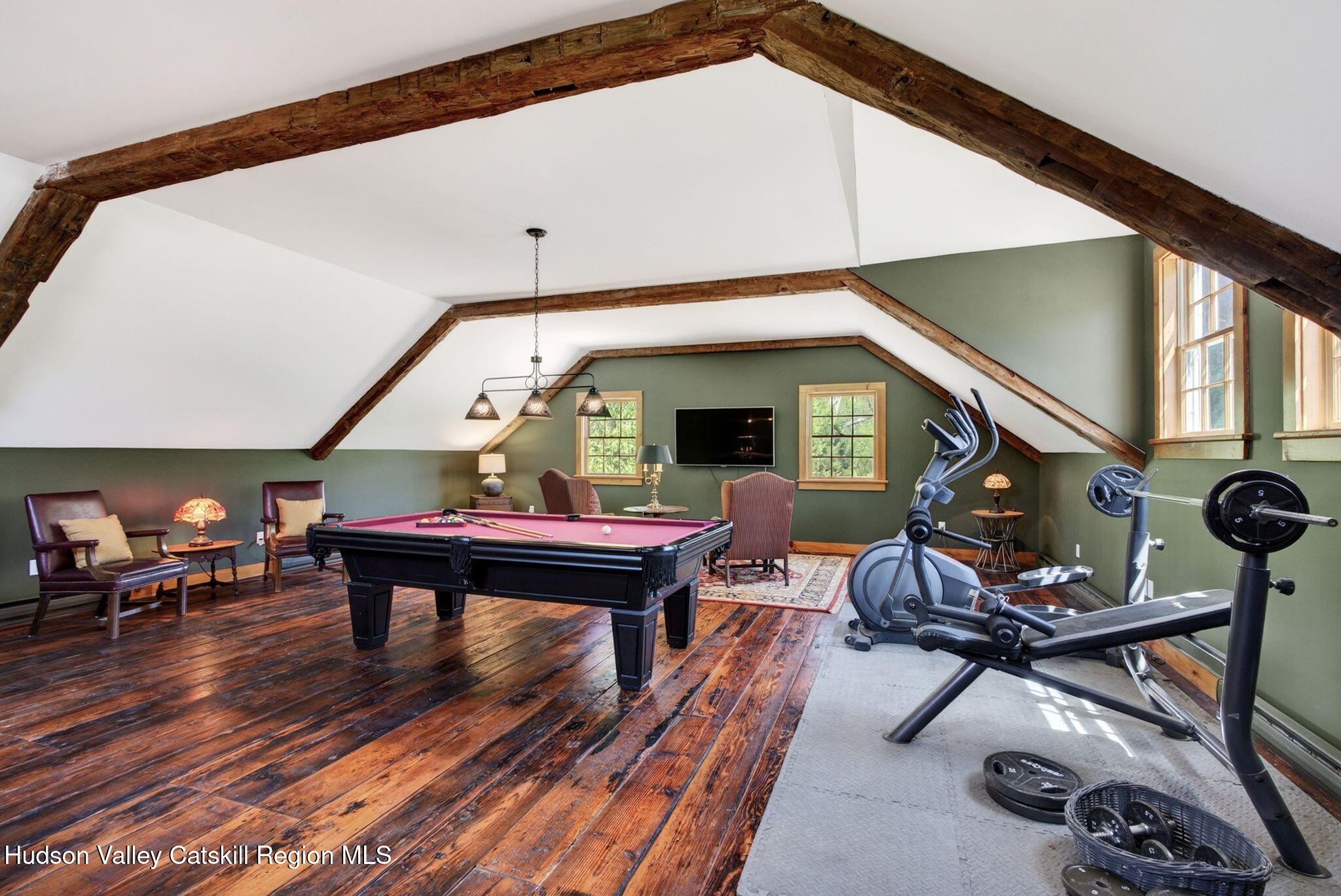 1429 Jackson Corners Road Red Hook, NY 12571 - Photo 32 of 59 a living room with furniture a window and gym equipment