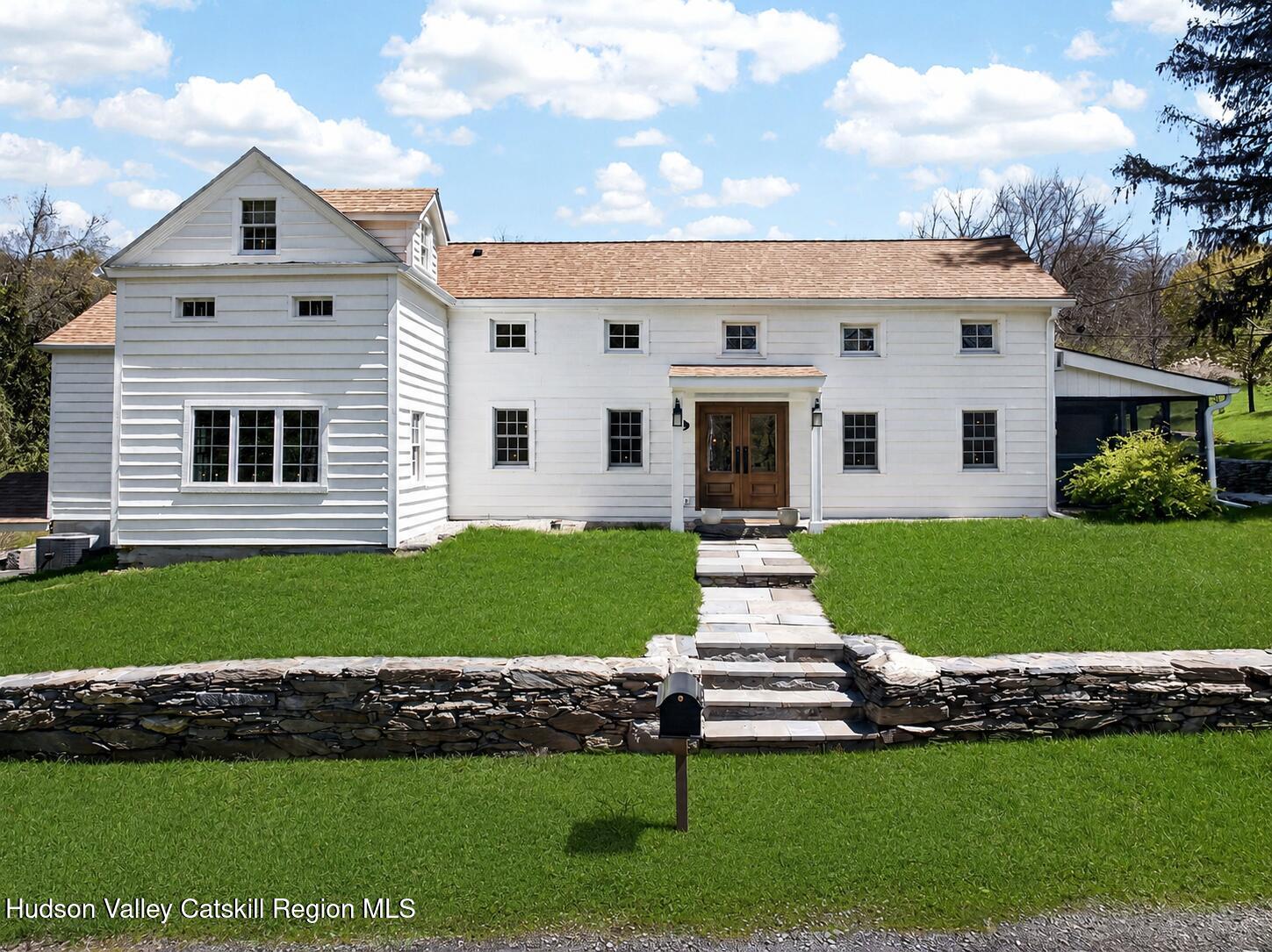 1429 Jackson Corners Road Red Hook, NY 12571 - Photo 34 of 59 a front view of a house with a yard