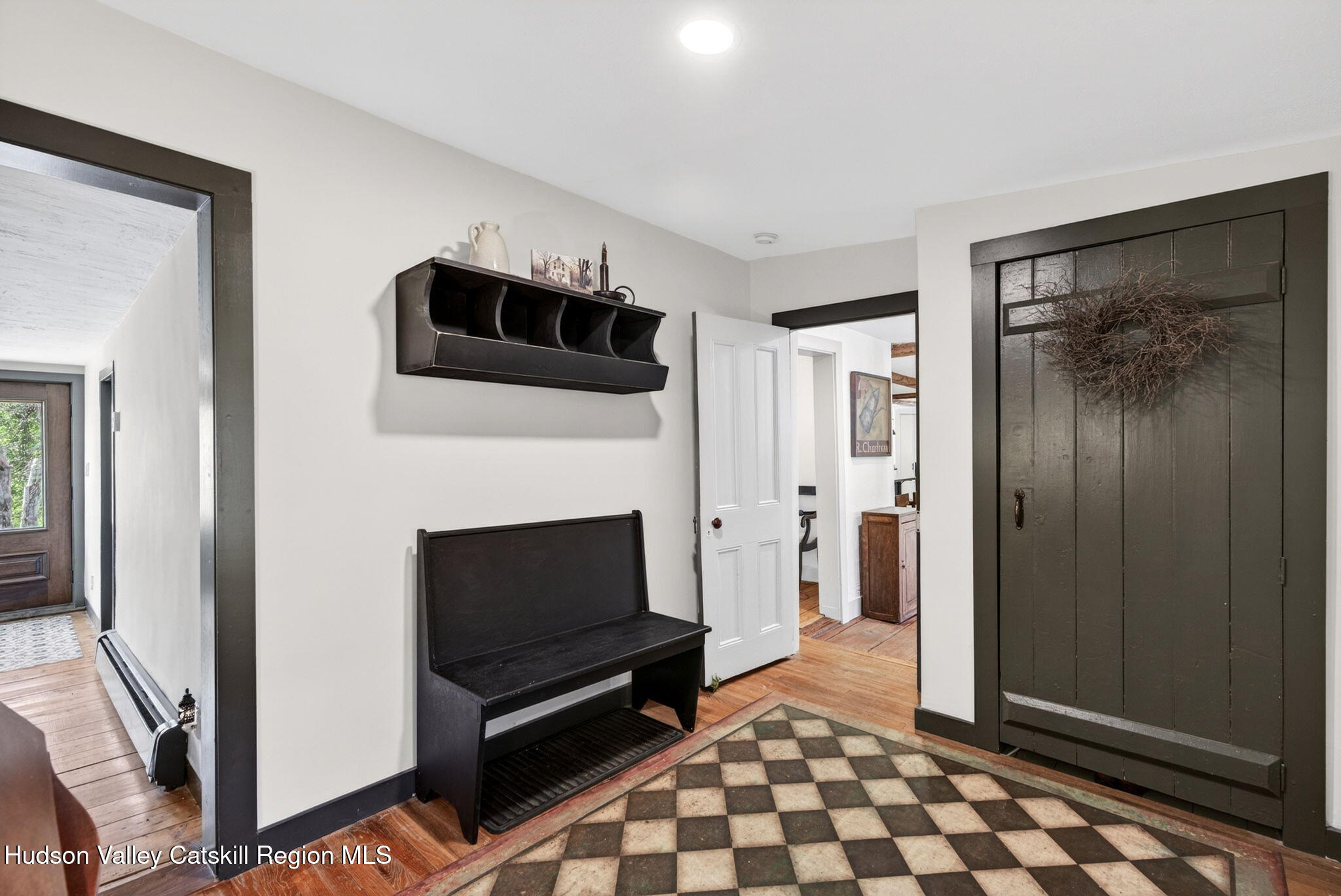 1429 Jackson Corners Road Red Hook, NY 12571 - Photo 37 of 59 a living room with a fireplace and a walk in closet