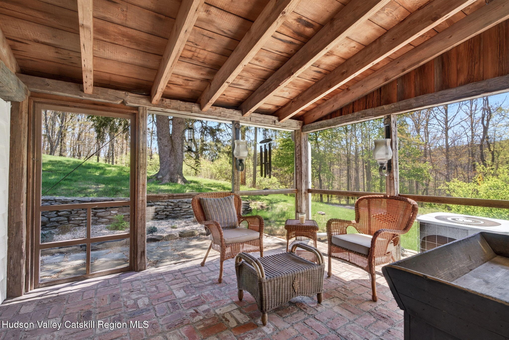1429 Jackson Corners Road Red Hook, NY 12571 - Photo 39 of 59 a living room with furniture floor to ceiling windows and a table