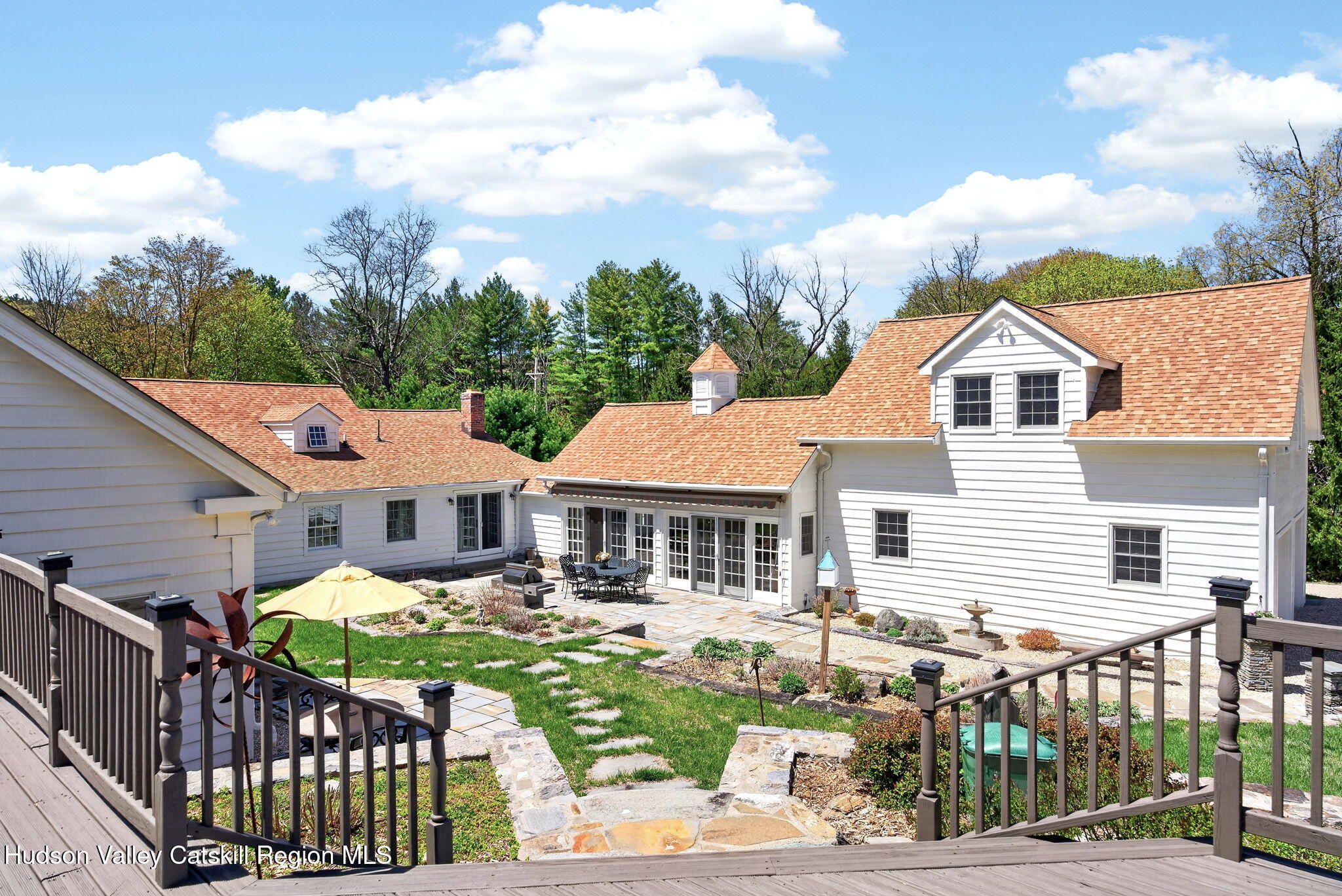 1429 Jackson Corners Road Red Hook, NY 12571 - Photo 44 of 59 a front view of a house with garden and patio