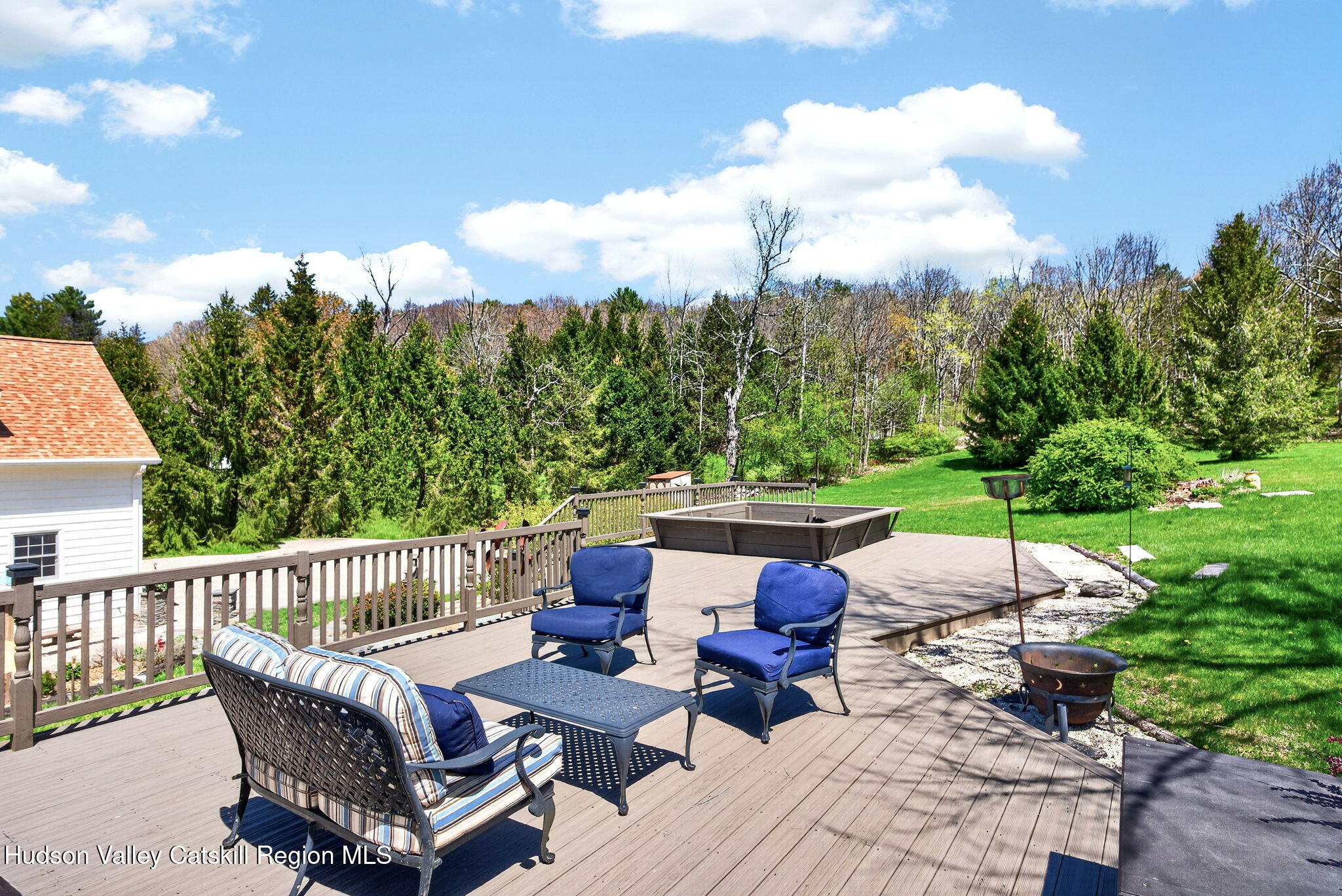 1429 Jackson Corners Road Red Hook, NY 12571 - Photo 46 of 59 a view of a patio with couches chairs and a fire pit