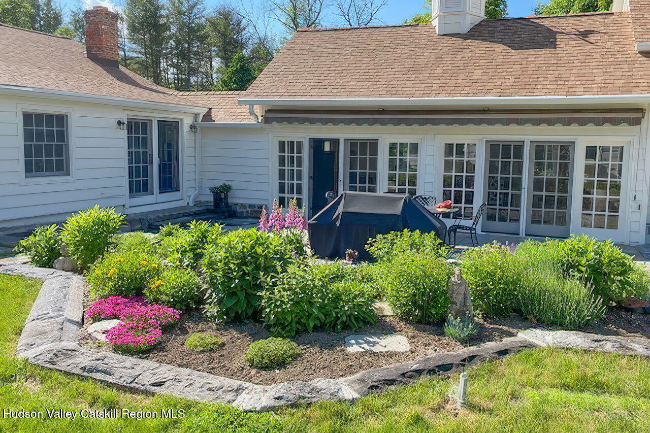 1429 Jackson Corners Road Red Hook, NY 12571 - Photo 51 of 59 a front view of a house with a yard and potted plants