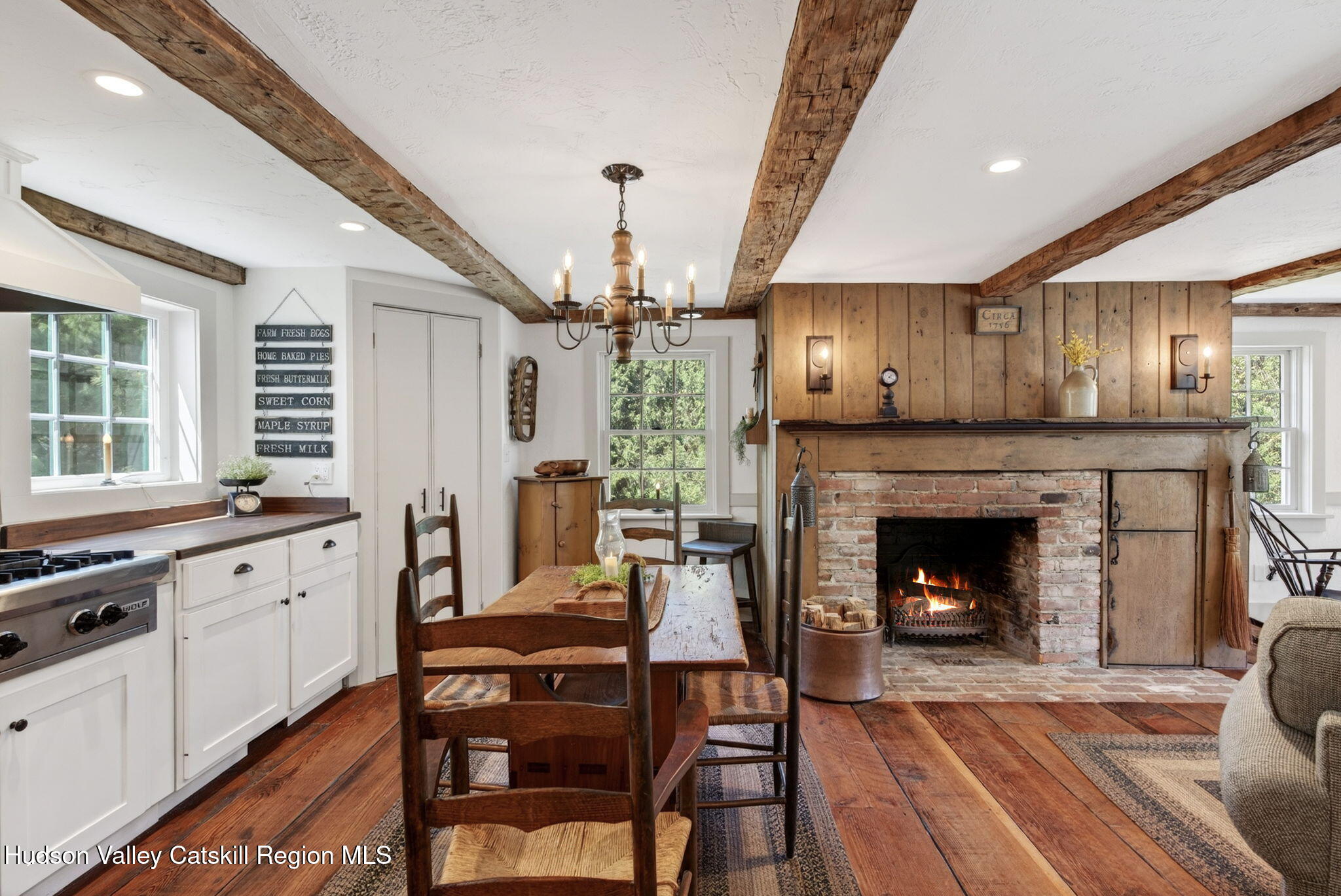 1429 Jackson Corners Road Red Hook, NY 12571 - Photo 9 of 59 a open kitchen with furniture a fireplace and wooden floors