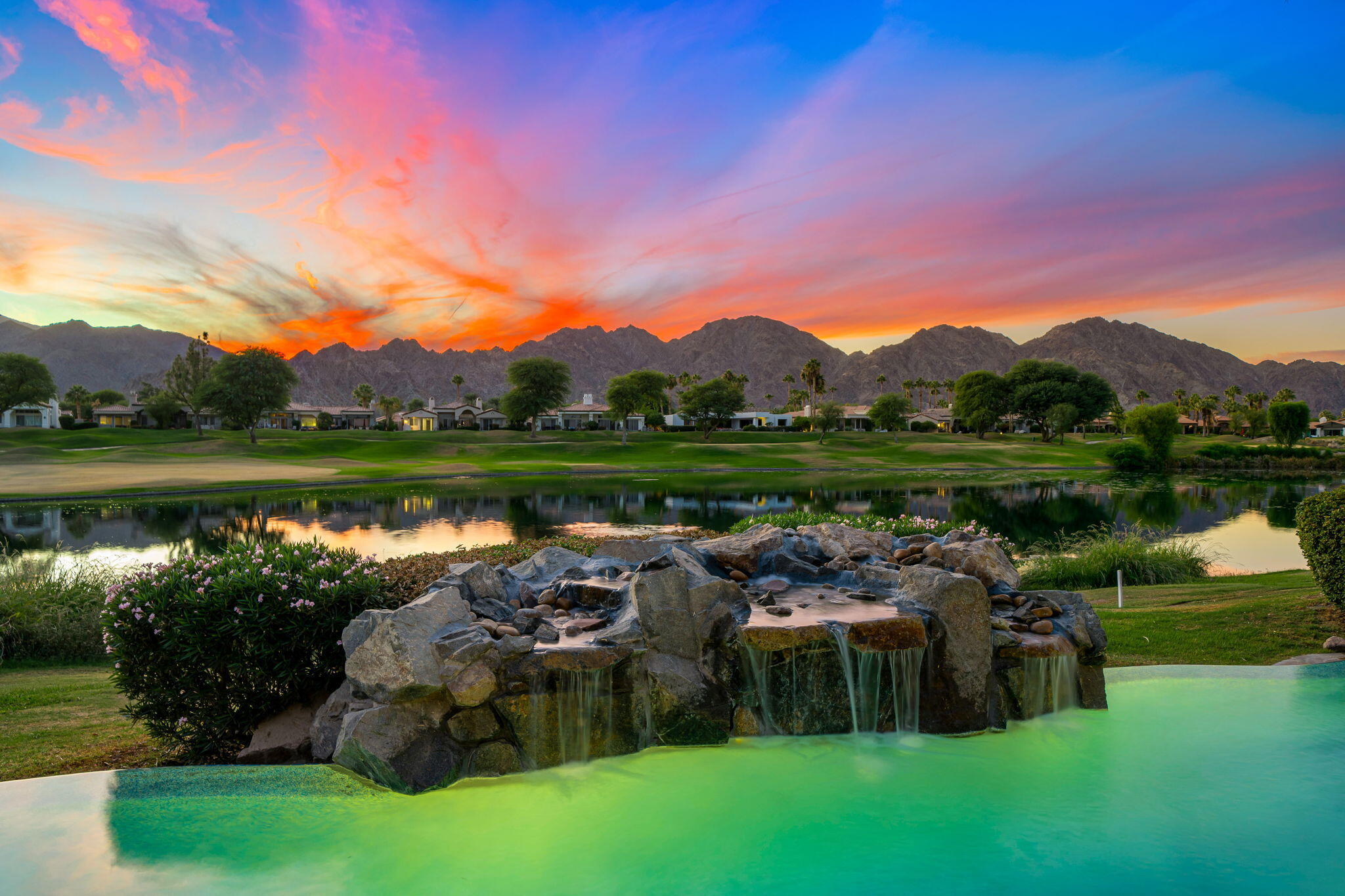 80218 Hermitage La Quinta, CA 92253 - Photo 3 of 92 a front view of a house with garden and lake view