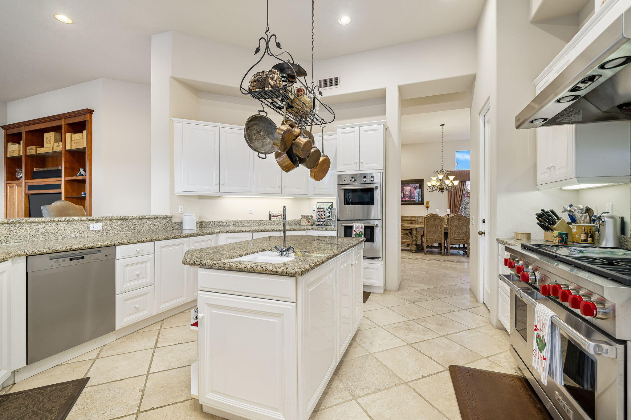 80218 Hermitage La Quinta, CA 92253 - Photo 48 of 92 a kitchen with a sink stove and cabinets