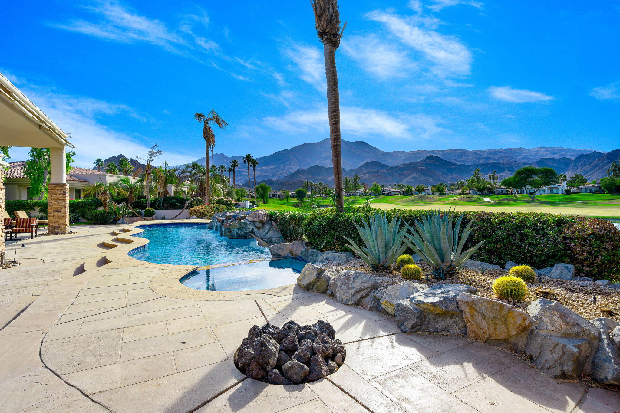 80218 Hermitage La Quinta, CA 92253 - Photo 54 of 92 a view of a swimming pool with a patio and a garden