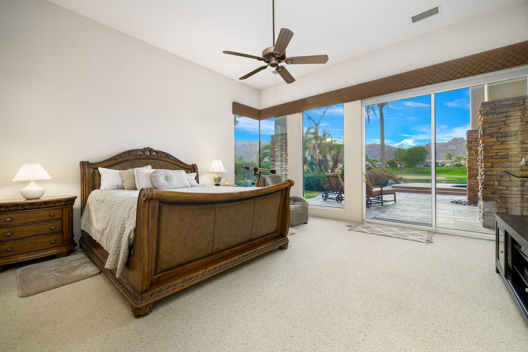80218 Hermitage La Quinta, CA 92253 - Photo 73 of 92 a bedroom with a bed and a ceiling fan