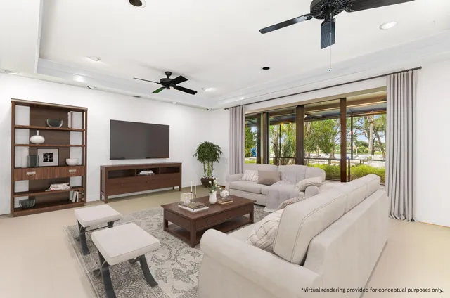 a living room with furniture and a floor to ceiling window