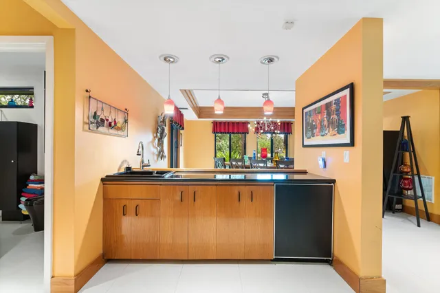 a bathroom with a sink a vanity and shower