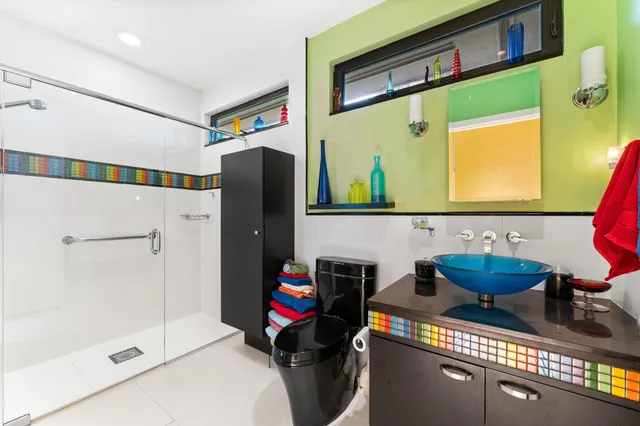 a kitchen with stainless steel appliances a sink stove and cabinets