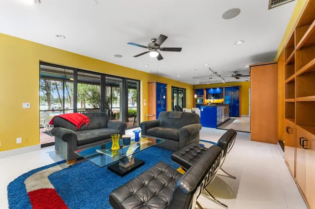 a bedroom with a large bed and a potted plant