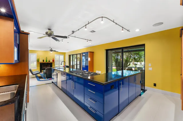 a spacious bathroom with a sink and a mirror