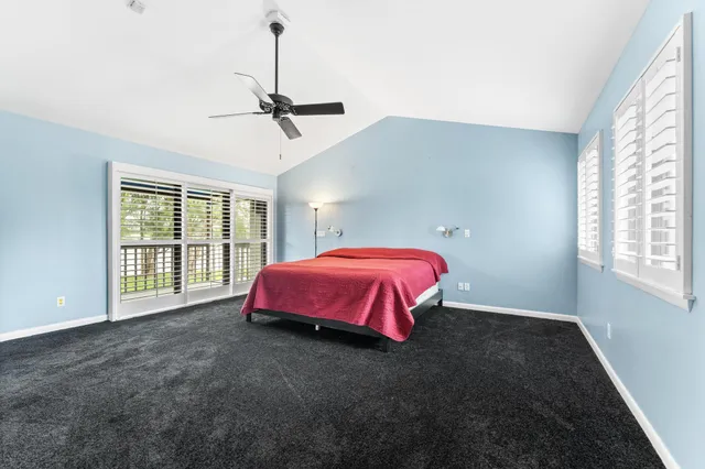 a view of a living room and a floor to ceiling window