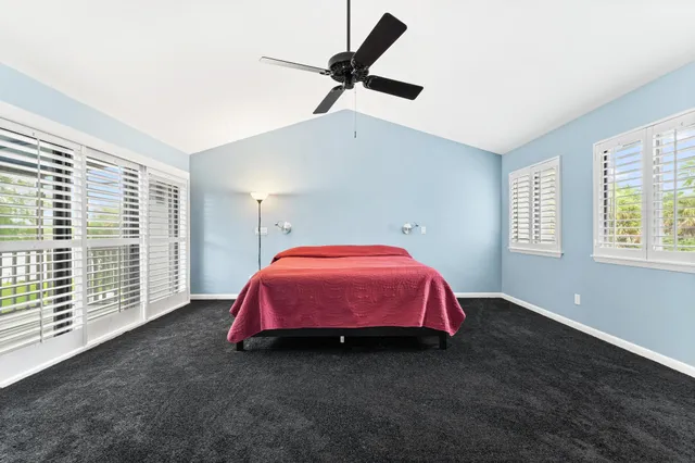 a view of a patio with dining table and chairs