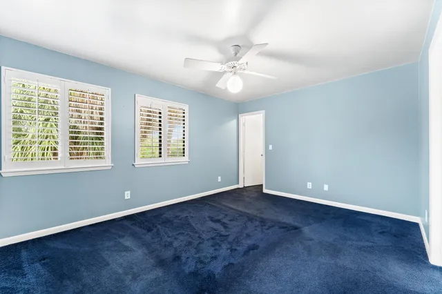 a view of a lake with houses in the back