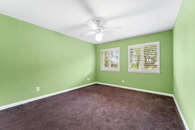 a view of a swimming pool with an outdoor seating