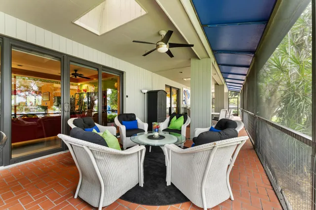 a view of a swimming pool with a yard and mountain view