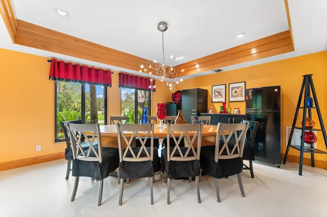 a living room with furniture fireplace and a large window