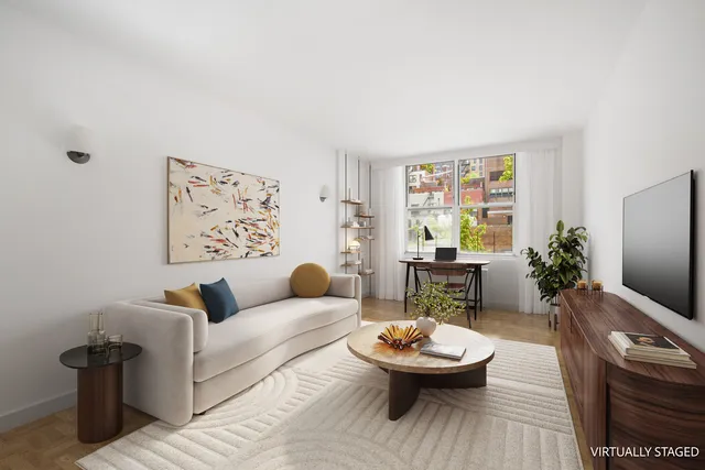 a bedroom with furniture and a book shelf