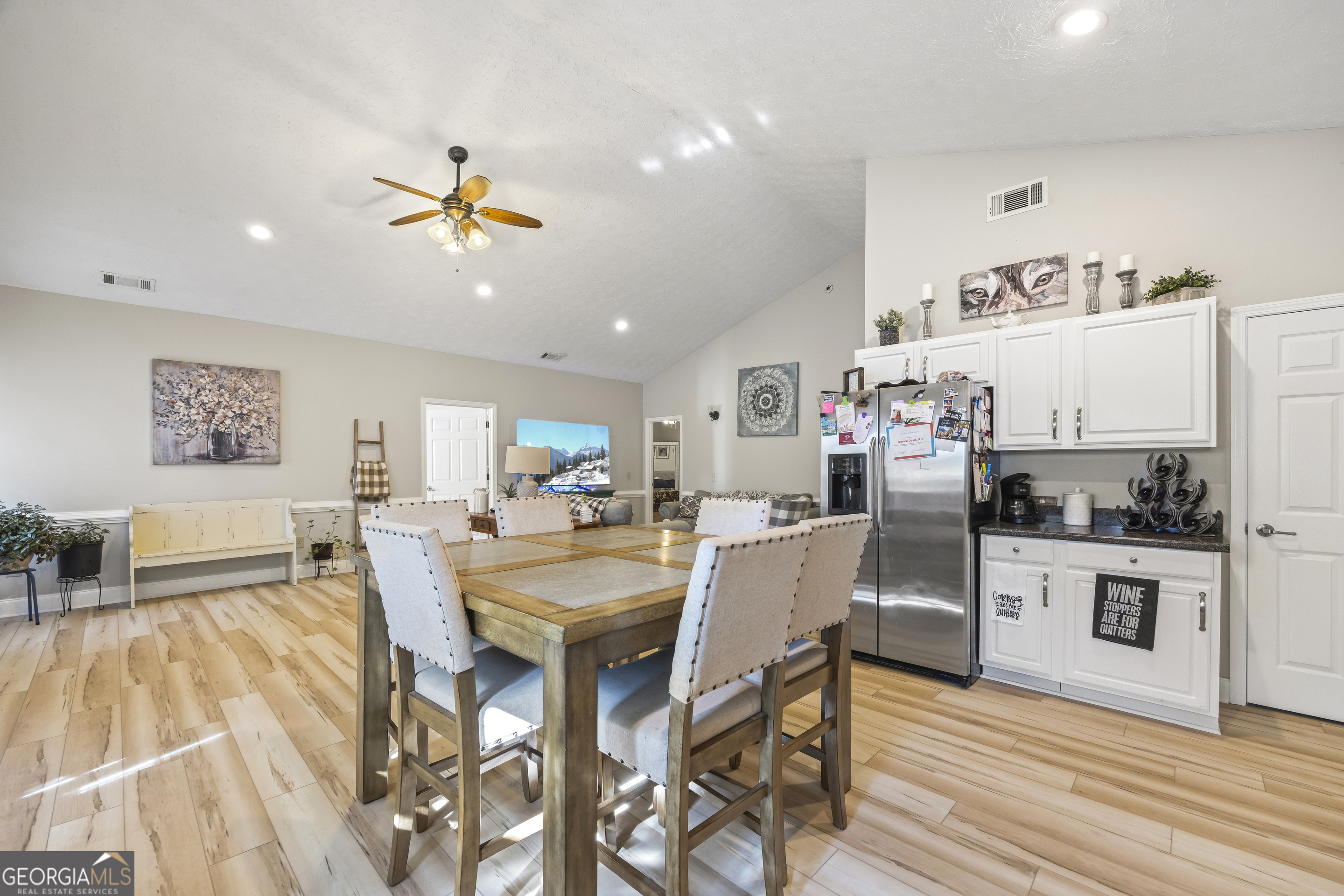 2894 Chase Road Cornelia, GA 30531 - Photo 103 of 142 a view of a dining room with furniture and wooden floor