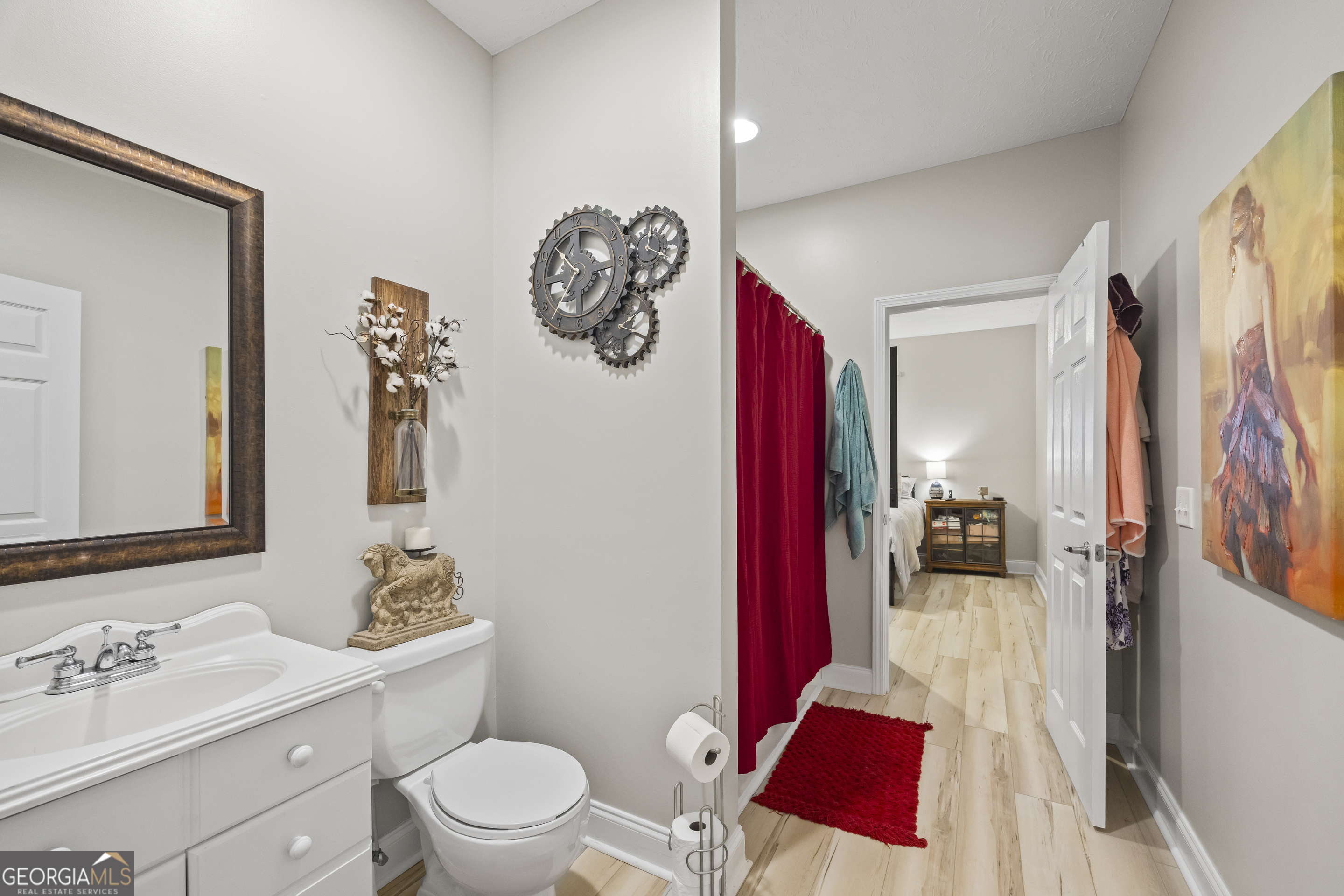 2894 Chase Road Cornelia, GA 30531 - Photo 112 of 142 a bathroom with a sink vanity mirror and toilet