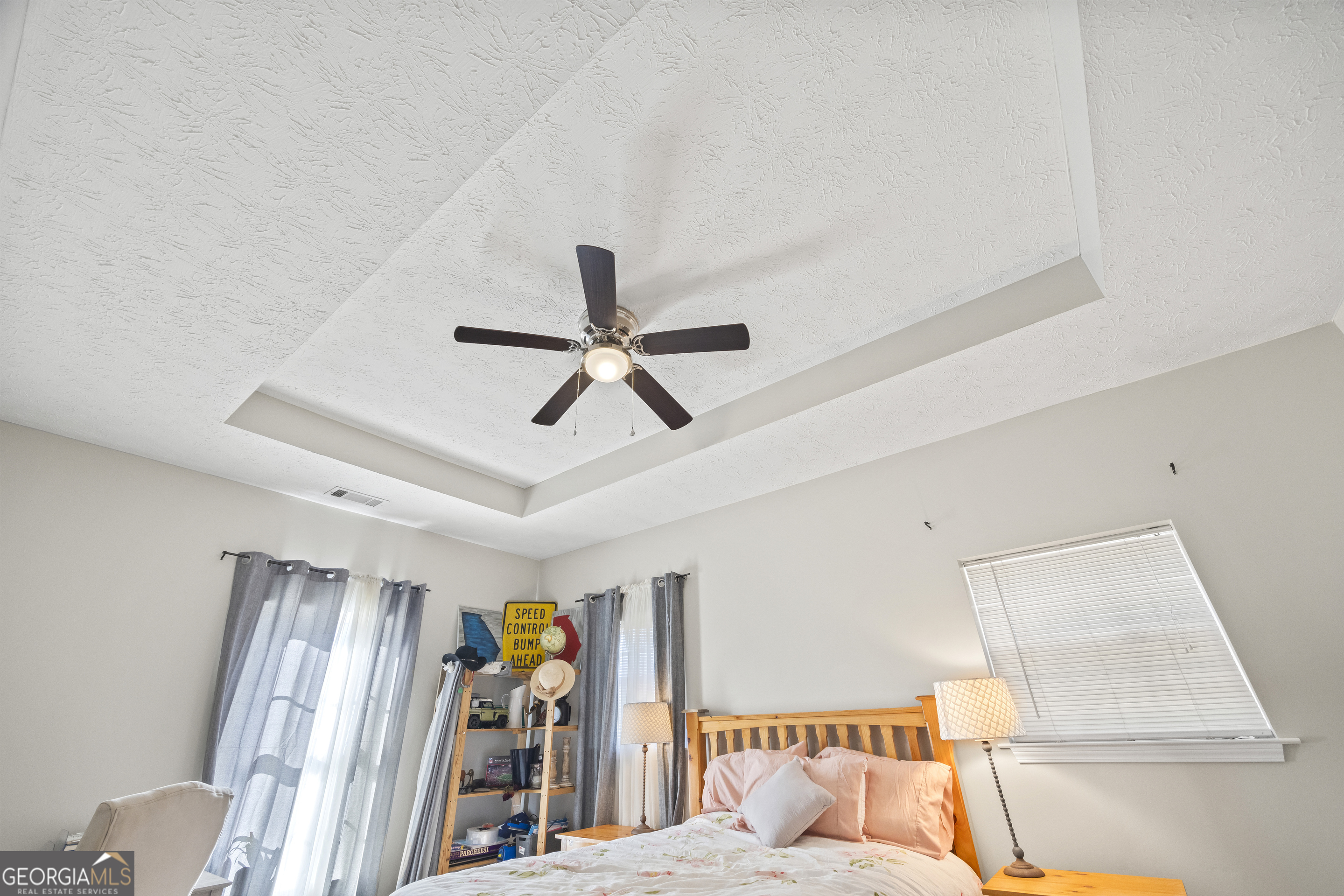 2894 Chase Road Cornelia, GA 30531 - Photo 118 of 142 a bedroom with a bed and a ceiling fan