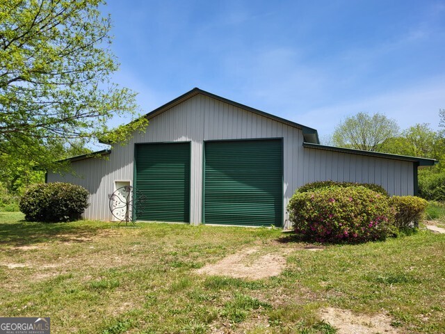 2894 Chase Road Cornelia, GA 30531 - Photo 142 of 142 a house with green field in front of it