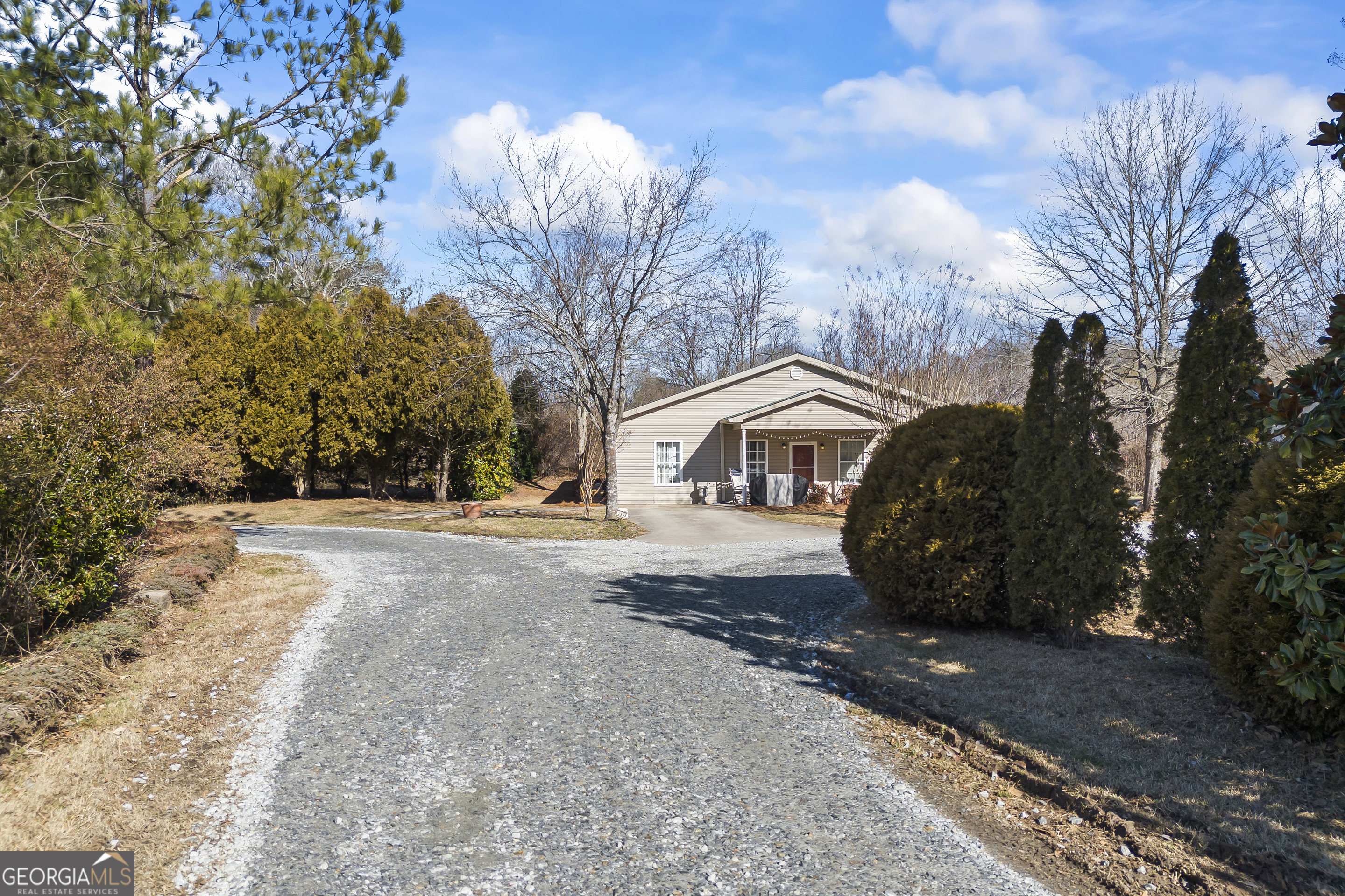 2894 Chase Road Cornelia, GA 30531 - Photo 23 of 142 a front view of a house with a yard and garage