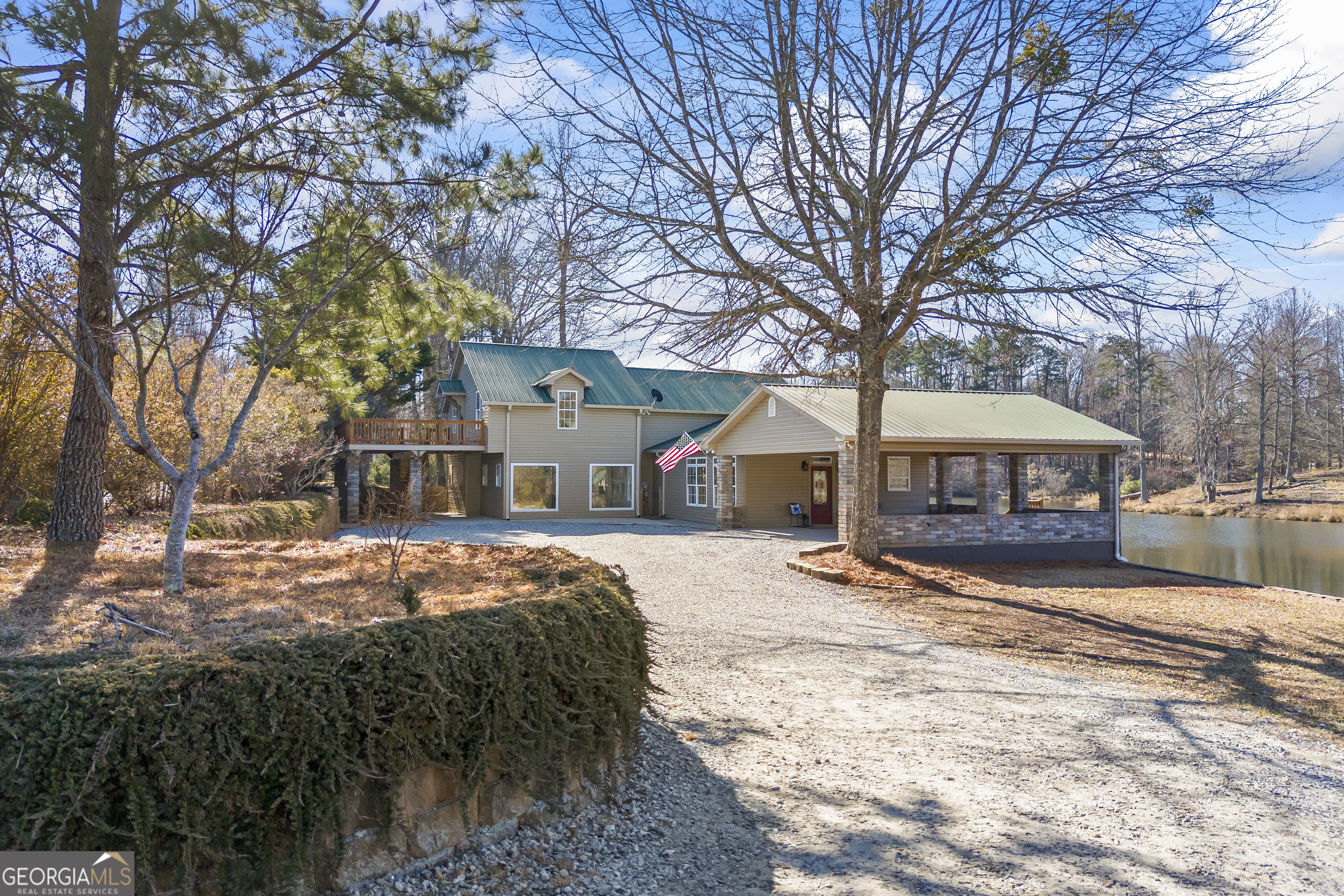 2894 Chase Road Cornelia, GA 30531 - Photo 25 of 142 a front view of a house with yard covered in snow